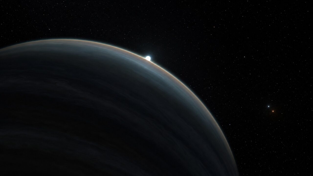 Conceptual illustration of gas giant WD 1856 b making a grazing transit across a small white dwarf